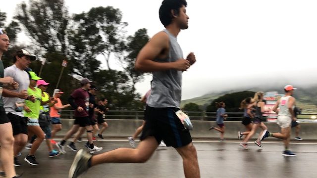 Despite a damp start, cheers abound as the SLO half marathon gets underway